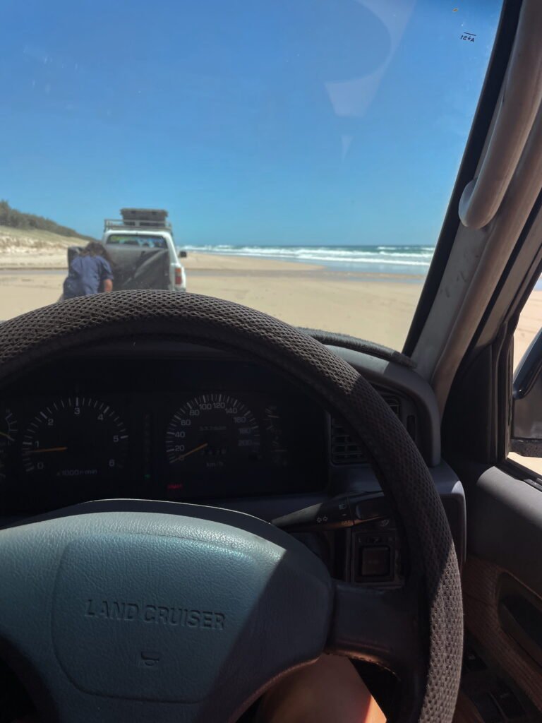 Land Cruiser Driving on the beach of K'Gari Fraser Island.